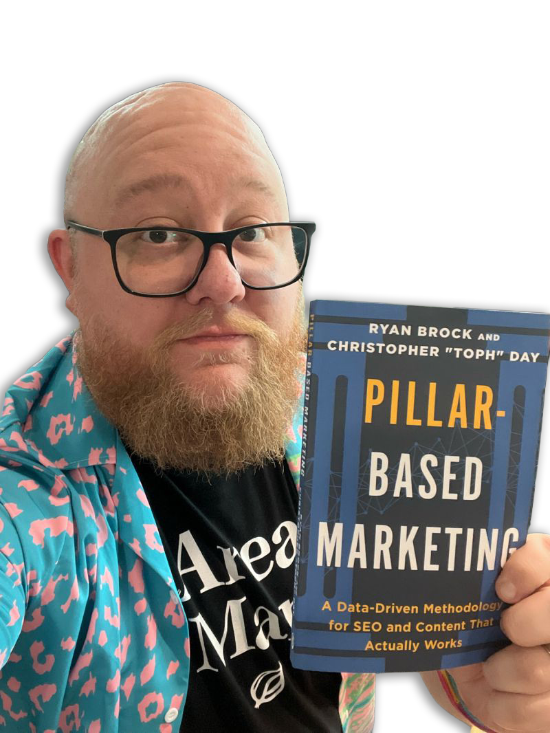 Ryan Brock holding the Pillar-Based Marketing book